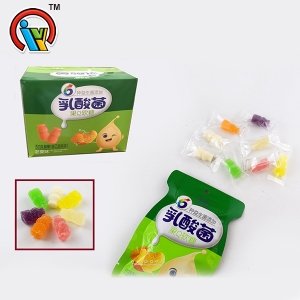 bacterias de ácido láctico en forma de botella de jugo de fruta dulces de masticación