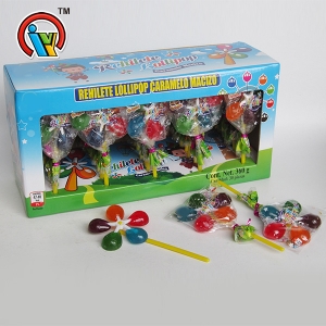 lollipop sabor dulce fruta colorida molino de viento en caja